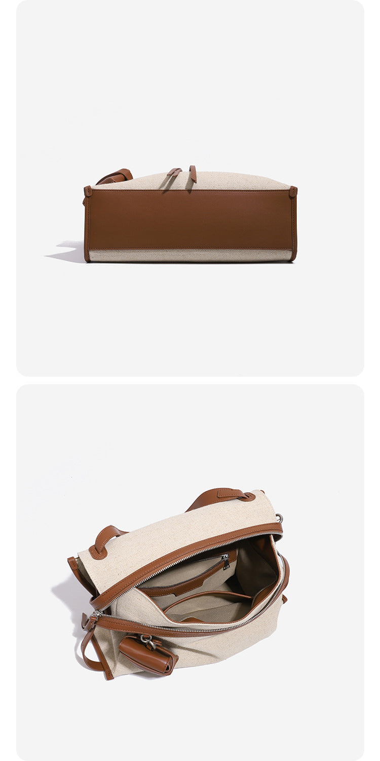 Cream canvas zip-top shoulder bag with cognac leather-look trim, dual zipper, attached mini pouch, and tassel strap ties