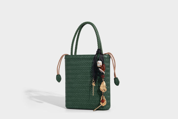 Small structured woven-texture tote bag with braided top handles and drawstring inner pouch, detail view 20