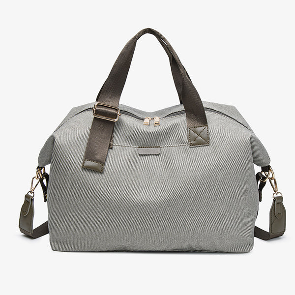 Structured woven duffel bag with dual tan webbing handles, detachable shoulder strap, top zip closure, and gold-tone