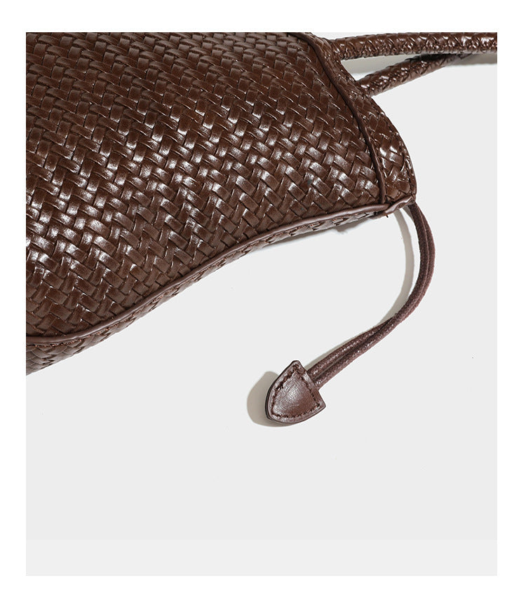 Structured woven leather-look tote bag in dark brown with long shoulder straps, side drawstring ties, and gold filigree