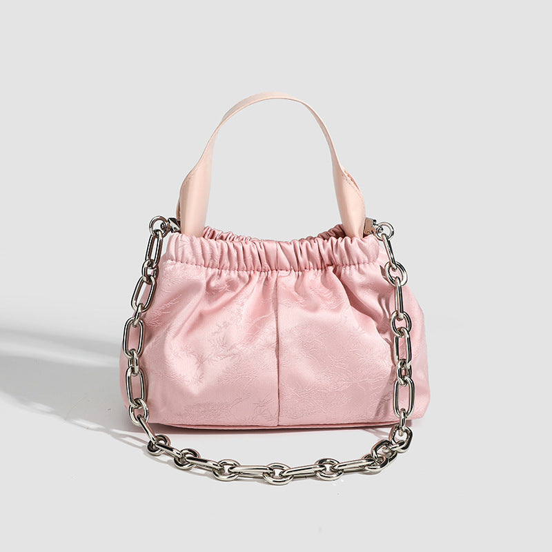 Small ruched satin-finish cloud bag with elasticized drawstring top, short top handle, and chunky silver-tone chain strap