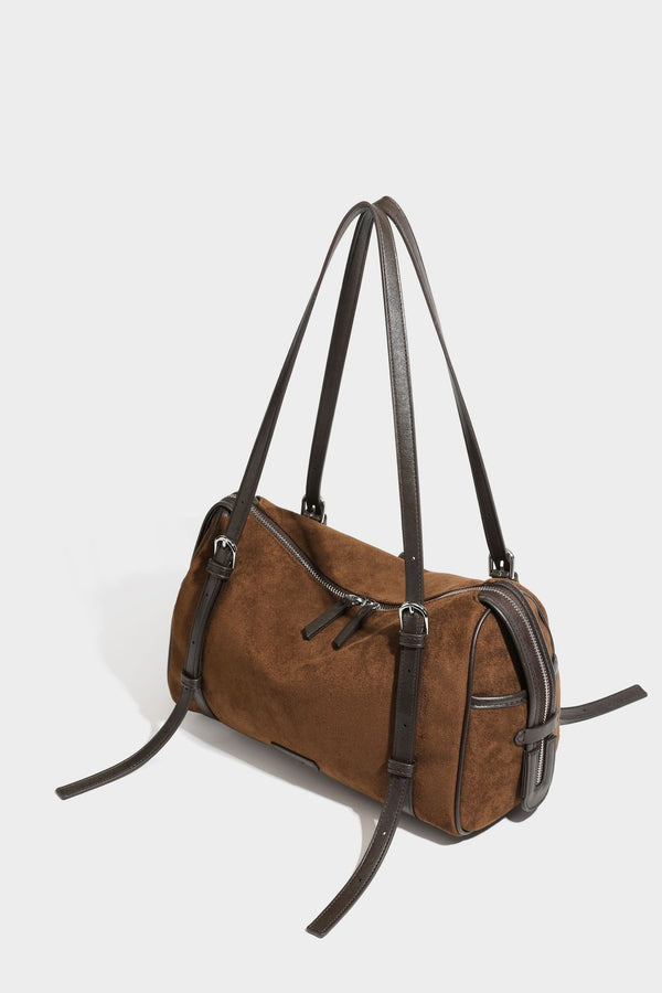 Large brown suede-finish barrel shoulder bag with dark leather-look trim, silver-tone zippers, dual top handles, and long