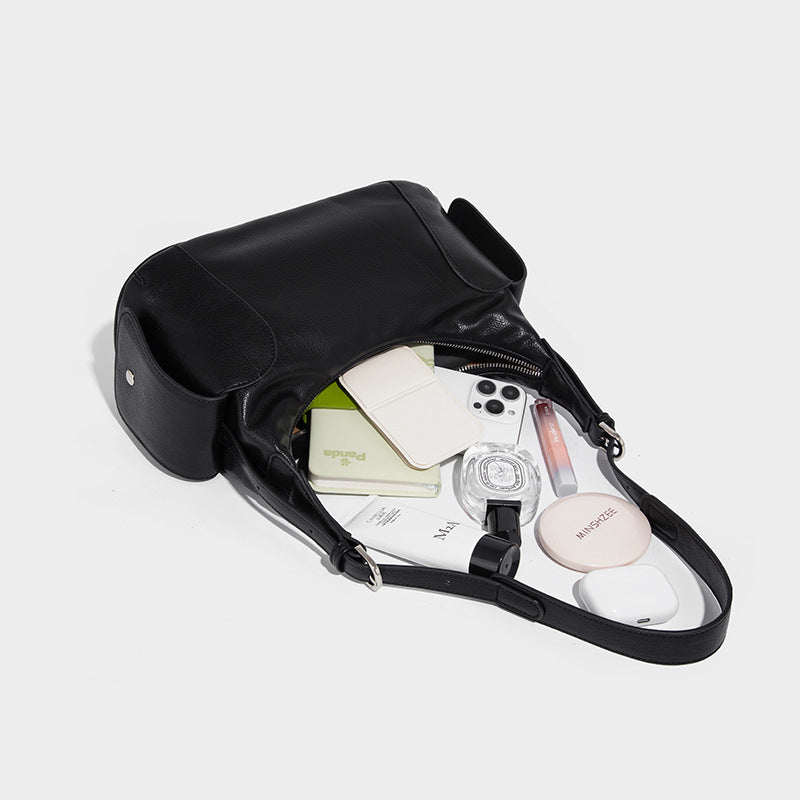 Soft pebbled leather-look hobo shoulder bag with zip top closure, side flap pockets, and silver-tone hardware, detail view 4