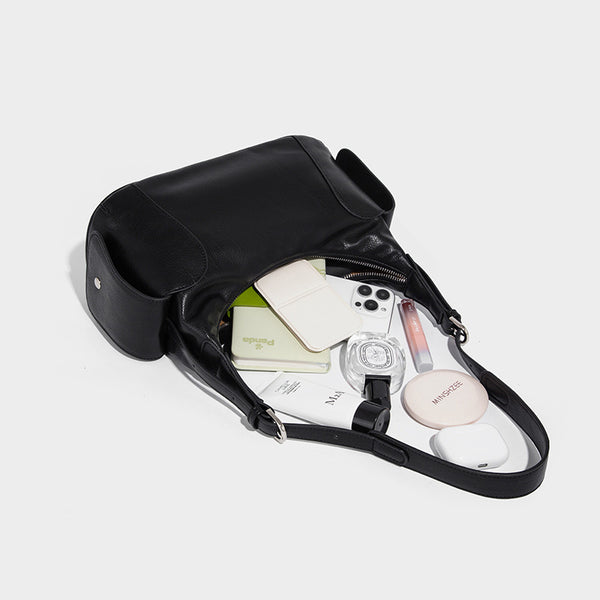 Soft pebbled leather-look hobo shoulder bag with zip top closure, side flap pockets, and silver-tone hardware, detail view 4