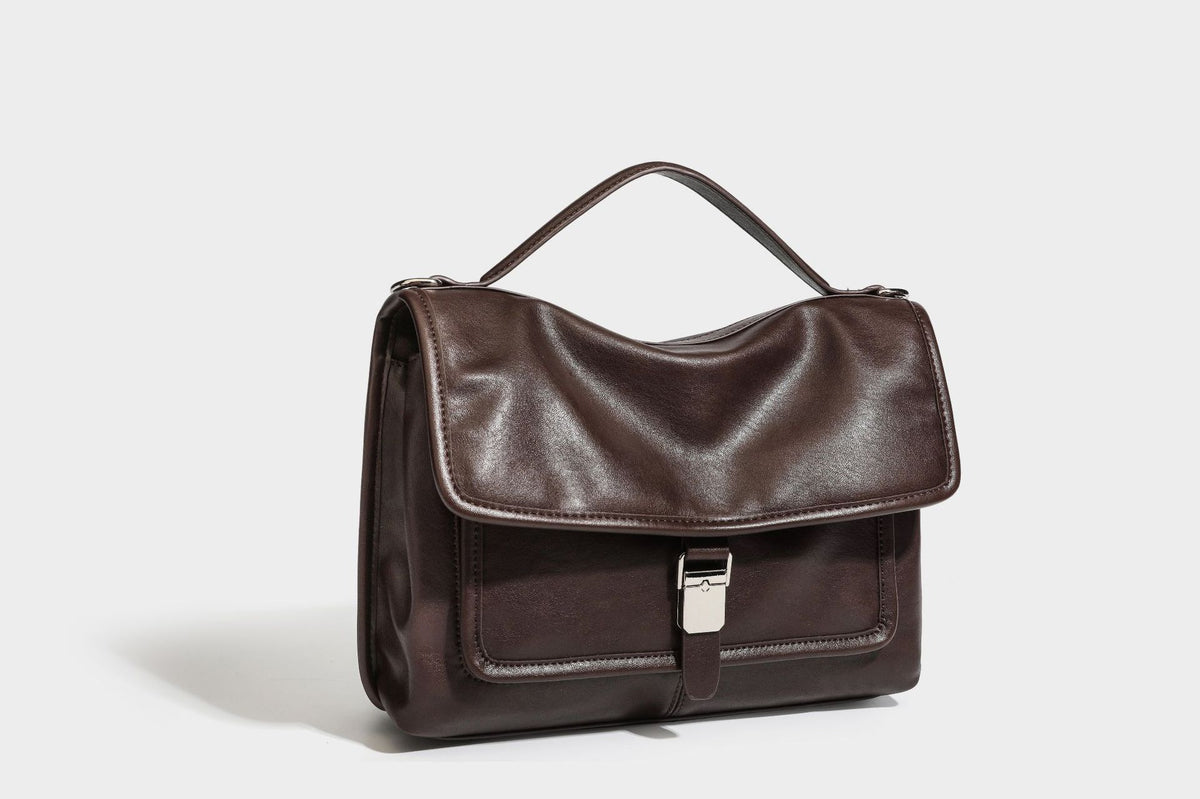 Structured rectangular satchel bag in dark espresso brown with smooth leather-look finish, flap front with silver turn-lock