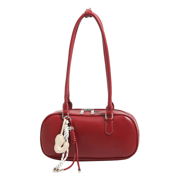 Compact rounded baguette shoulder bag with smooth leather-look finish, slim double straps, silver-tone zipper hardware, and
