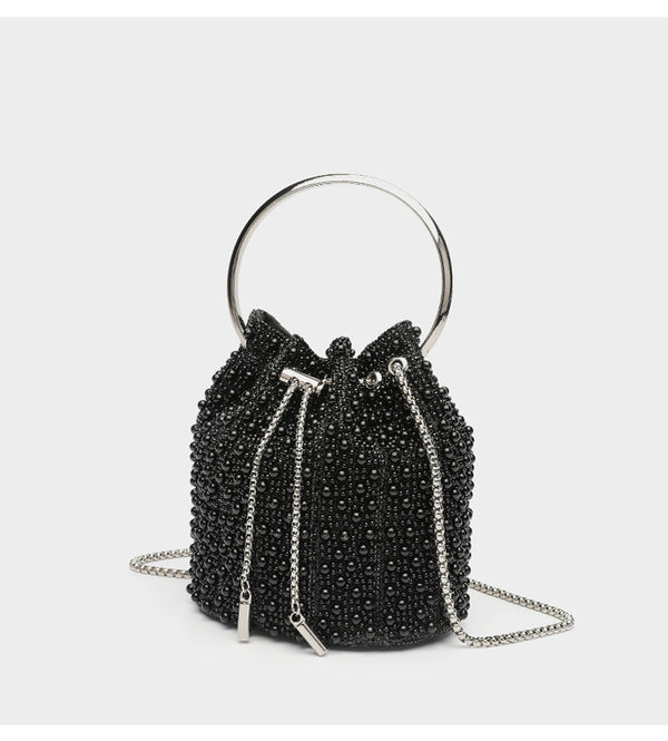 Small pearl-beaded drawstring bucket bag with silver-tone ring top handle and chain shoulder strap, detail view 16