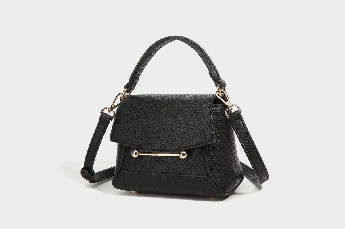 Small structured pebbled flap mini satchel with gold-tone bar hardware, short top handle, and detachable crossbody strap