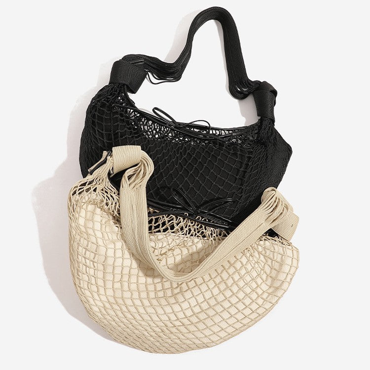 Crescent-shaped open-weave mesh shoulder bag with black drawstring cord tie and long padded strap, detail view 2