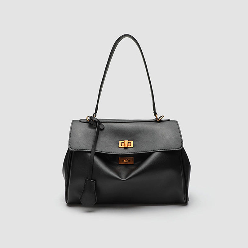 Structured black leather-look flap satchel bag with silver turn-lock hardware and top handle, detail view 7