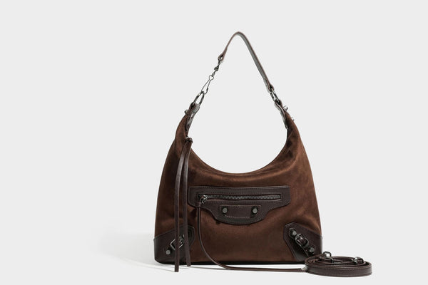 Slouchy suede-finish hobo shoulder bag with dark hardware, exterior zip pocket, tassel ties, and detachable crossbody strap