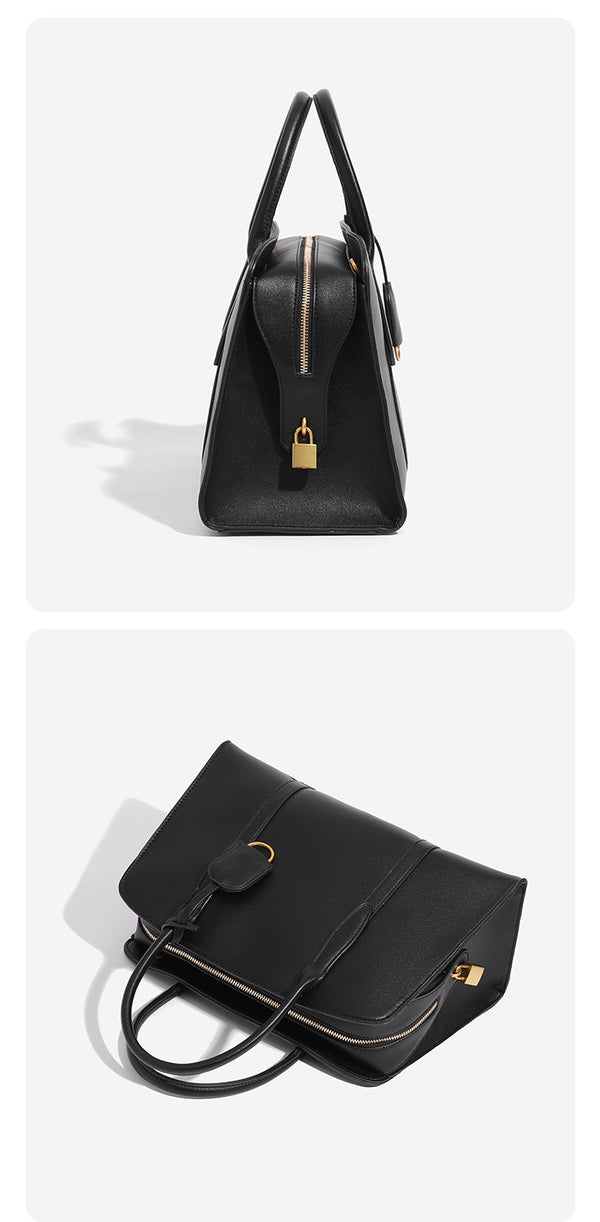 Structured trapezoid Boston satchel bag with dual top handles, gold-tone lock charm, and top zip closure, detail view 9