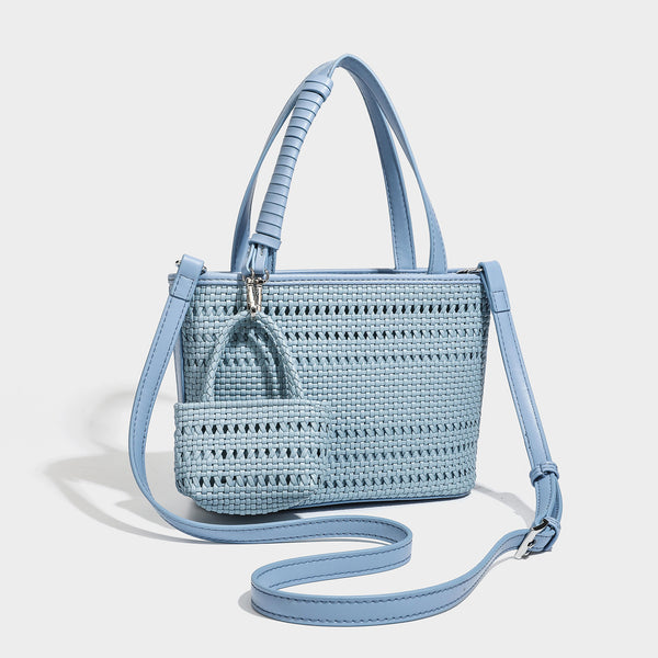 Structured open-weave tote bag with smooth leather-look trim, double top handles, detachable crossbody strap, and mini zip