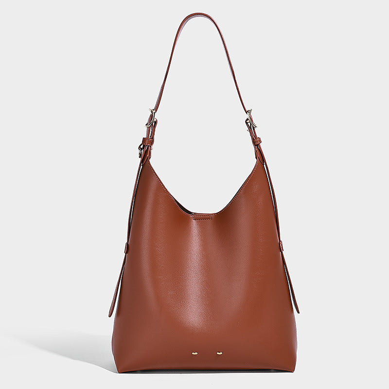 Large open-top hobo shoulder bag in tan leather-look finish with detachable zip pouch and adjustable buckle strap, detail