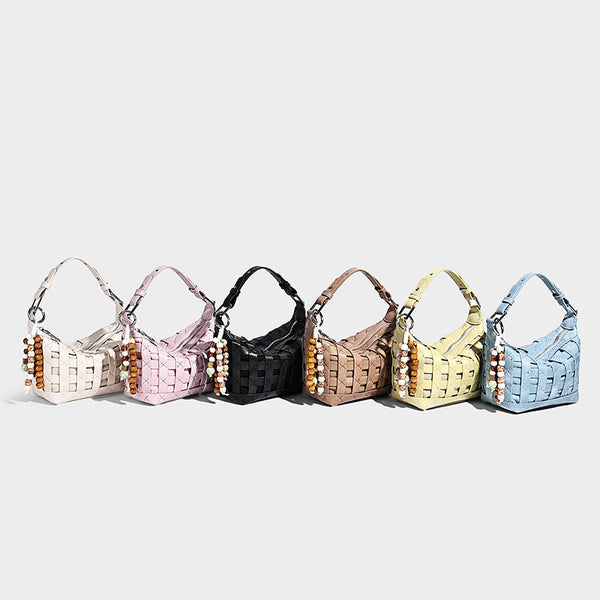 Small woven convertible shoulder bag with top zipper, silver-tone hardware, and detachable crossbody strap, detail view 2