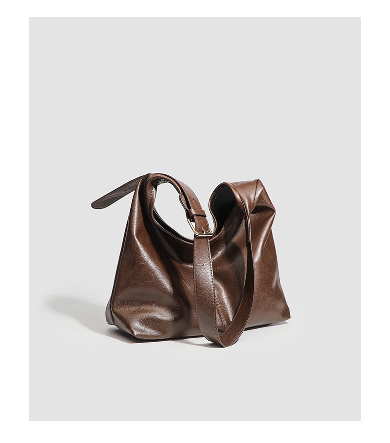Large slouchy hobo shoulder bag in smooth leather-look finish with adjustable strap and gold-tone hardware, detail view 13