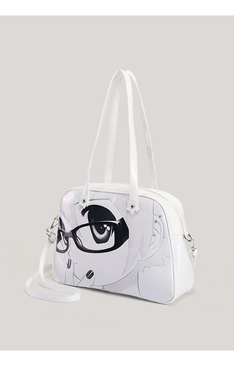 Glänzende weiße strukturierte Tote-Bag mit schwarz-weißem Anime-Gesichtsmotiv, Reißverschluss oben und zwei Henkeln, Detailansicht