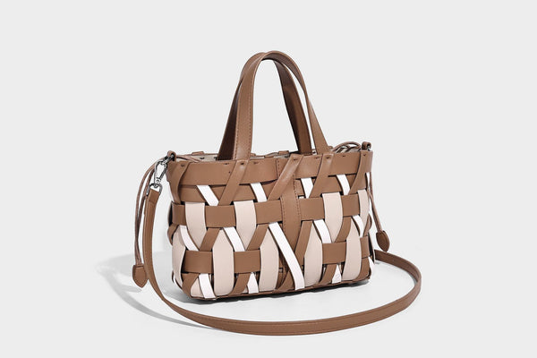 Small structured woven lattice tote bag with dual top handles and detachable shoulder strap in brown and cream leather-look