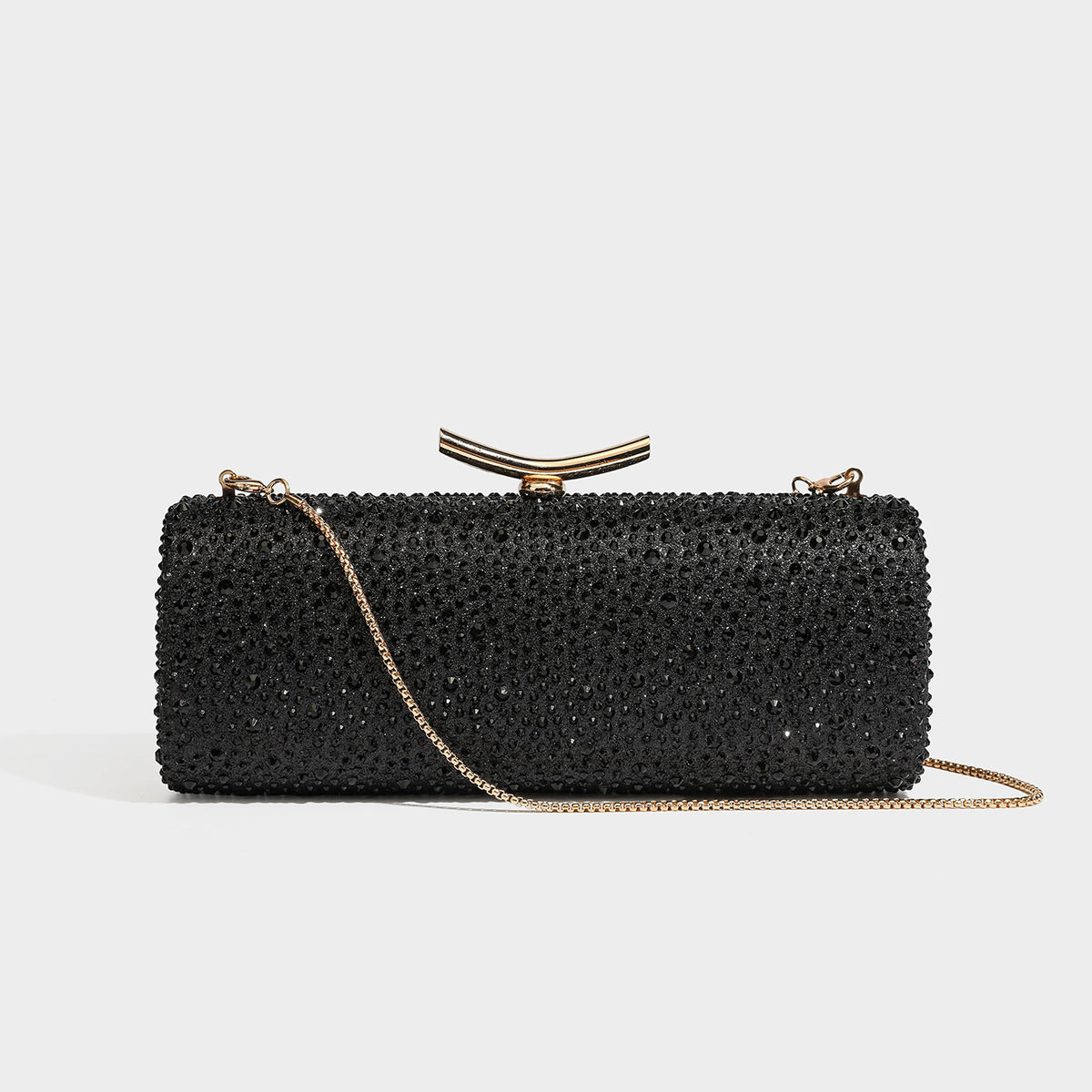 Structured rectangular hard-case clutch bag covered in all-over rhinestone crystal embellishment with curved kiss-lock top
