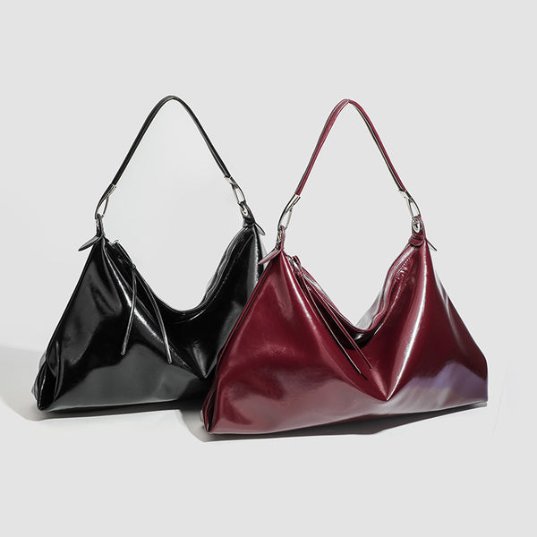 Glossy structured shoulder tote bag with silver-tone hardware and top zip closure, detail view 2