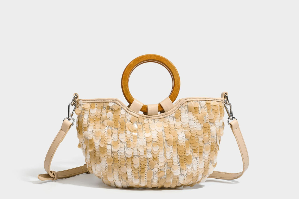 Small sequin half-moon handbag with circular wood-look ring handles and detachable leather-look shoulder strap, detail view