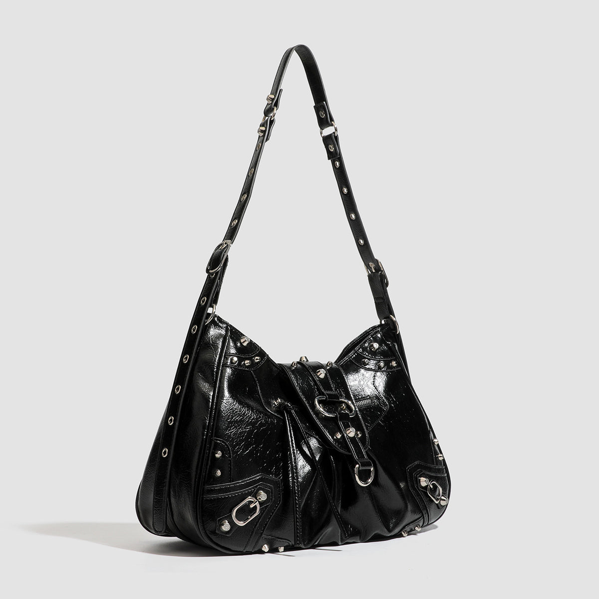 Black glossy studded hobo shoulder bag with silver rivet hardware, front buckle accent, and adjustable strap, detail view 2