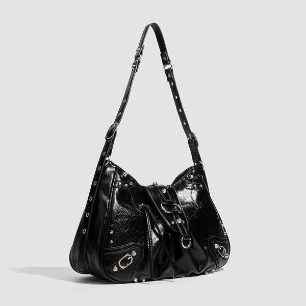 Black glossy studded hobo shoulder bag with silver rivet hardware, front buckle accent, and adjustable strap, detail view 2