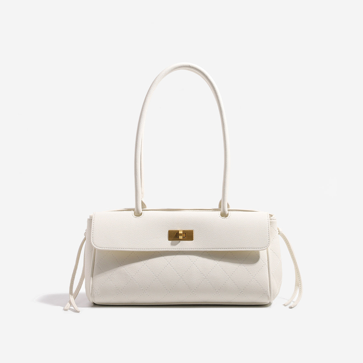 Structured quilted diamond top-handle underarm shoulder bag with gold-tone turn-lock flap closure and side tie straps, detail