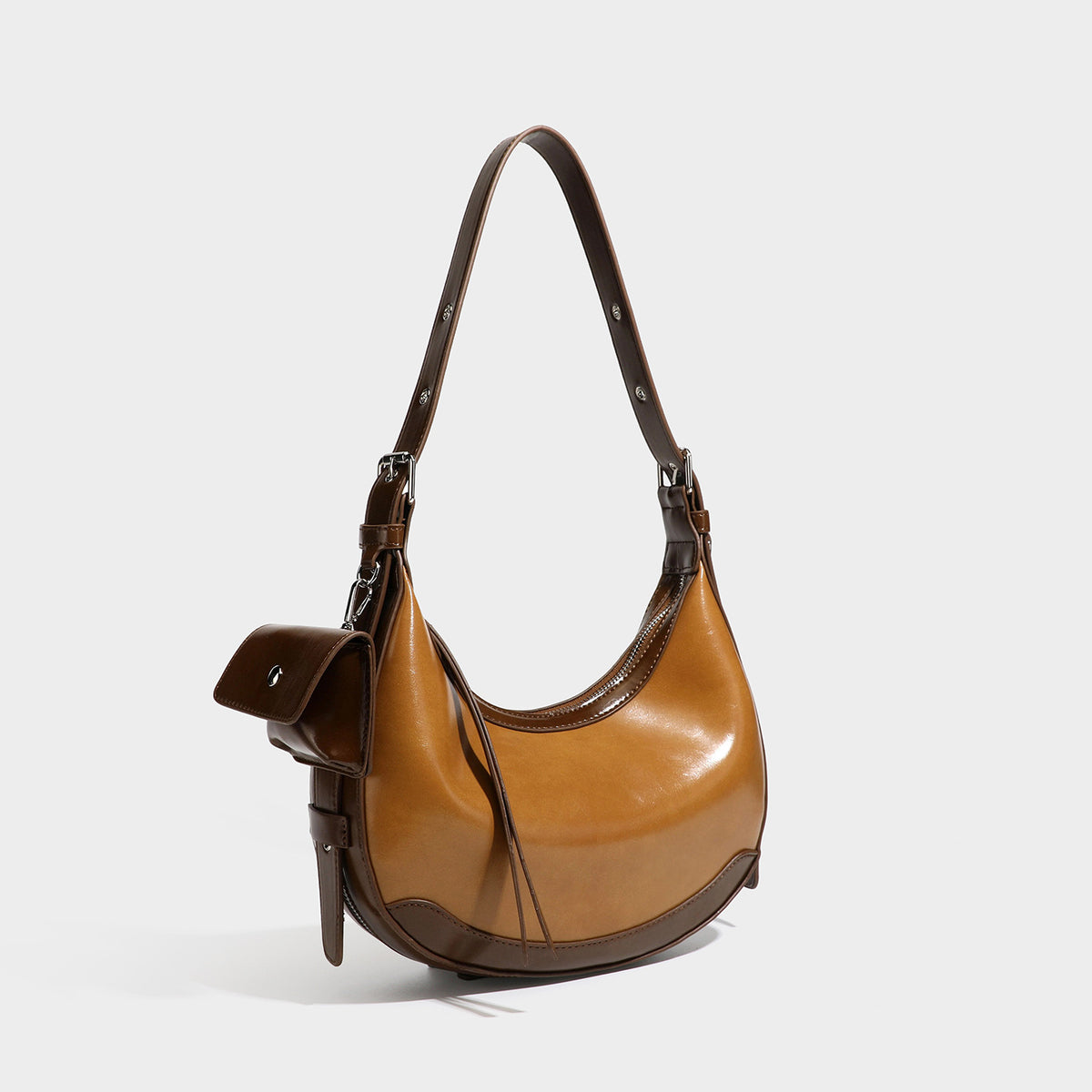 Glossy leather-look crescent hobo shoulder bag with dark contrast trim, silver-tone hardware, and attached mini flap pouch