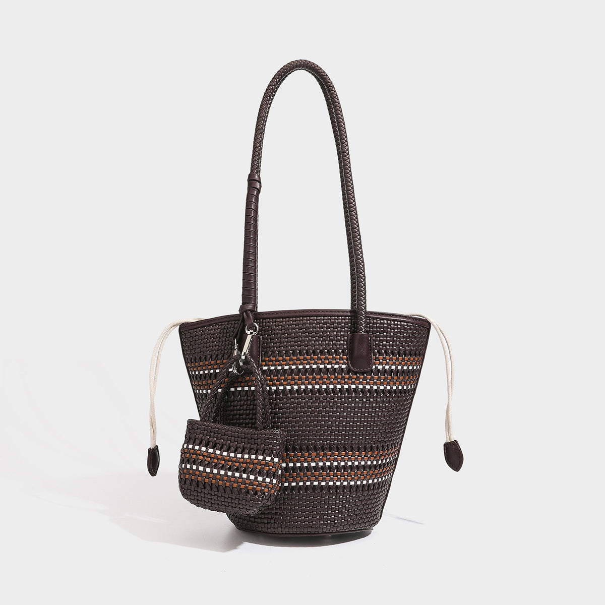 Structured woven bucket tote bag in pastel blue with braided shoulder strap, open lattice weave body, cream drawstring