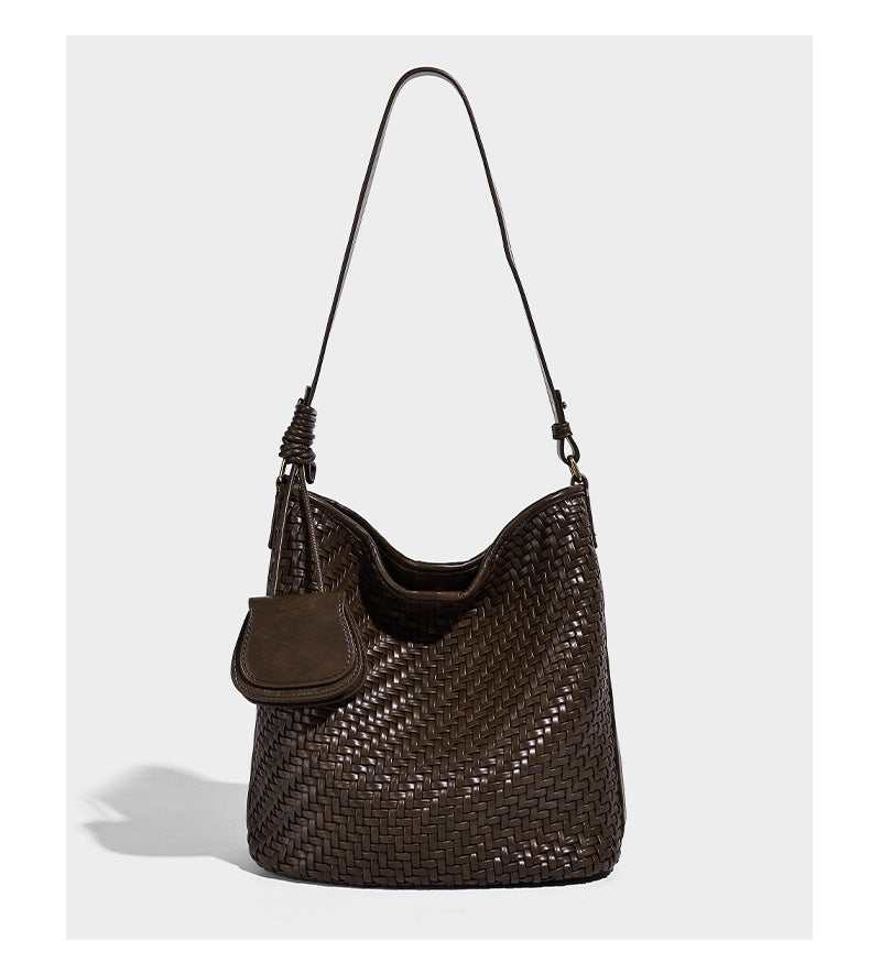 Woven leather-look bucket bag with basket-weave texture, attached mini pouch, and adjustable shoulder strap, detail view 11
