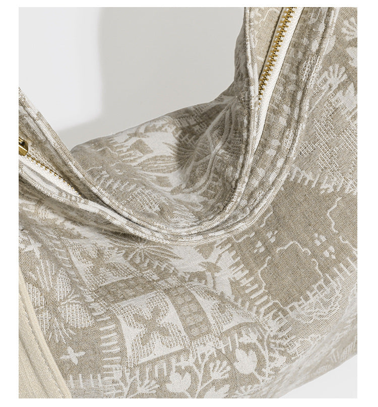 Weich fallende Hobo-Schultertasche aus Canvas mit botanischem Print, langem geknotetem Riemen und Reißverschluss oben, Detailansicht 19