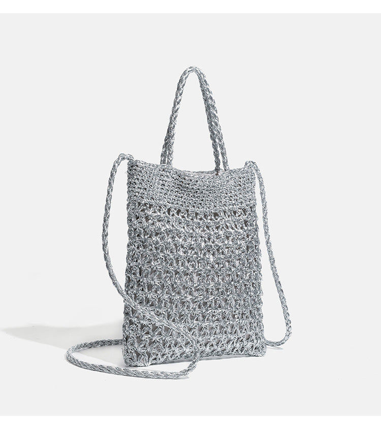Small soft rectangular metallic crochet-weave shoulder bag with braided top handle and long crossbody strap, detail view 10