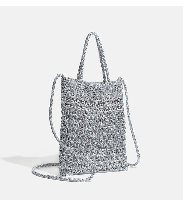 Small soft rectangular metallic crochet-weave shoulder bag with braided top handle and long crossbody strap, detail view 10