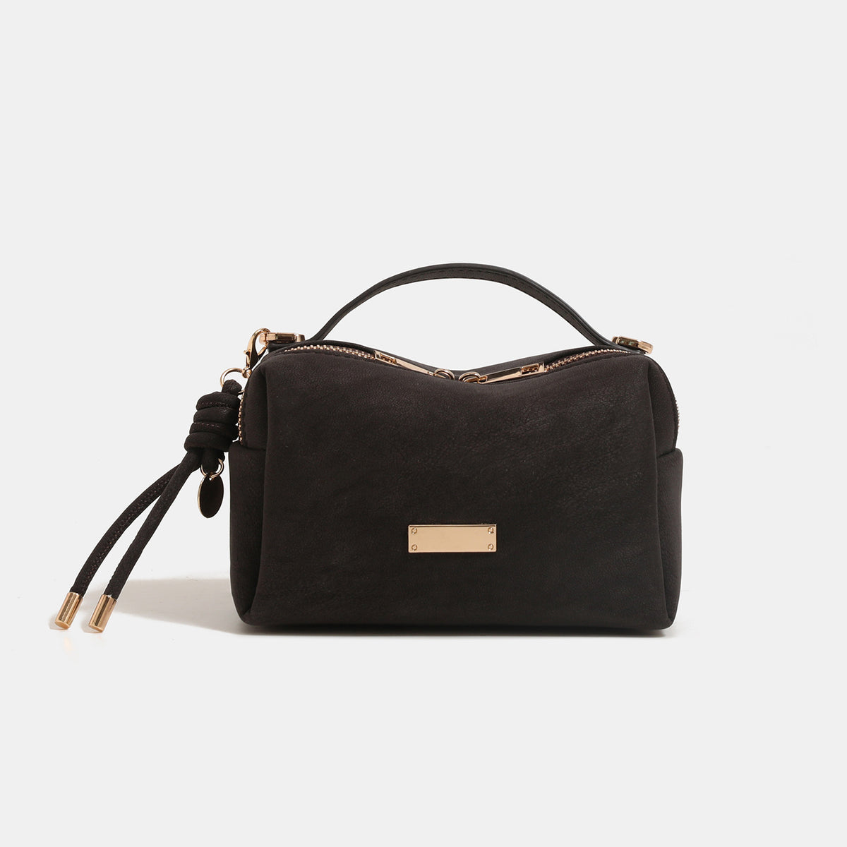 Compact structured rectangular box bag with textured leather-look exterior, top zip closure, short top handle, knotted cord