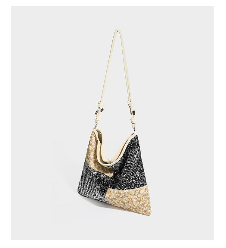 Slouchy hobo shoulder bag with black bugle-bead sequin and cream bouclé patchwork panels, adjustable cream leather-look