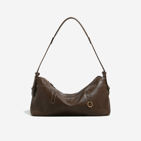 Slouchy hobo shoulder bag in smooth leather-look finish with zip closure and antique brass ring hardware, front view