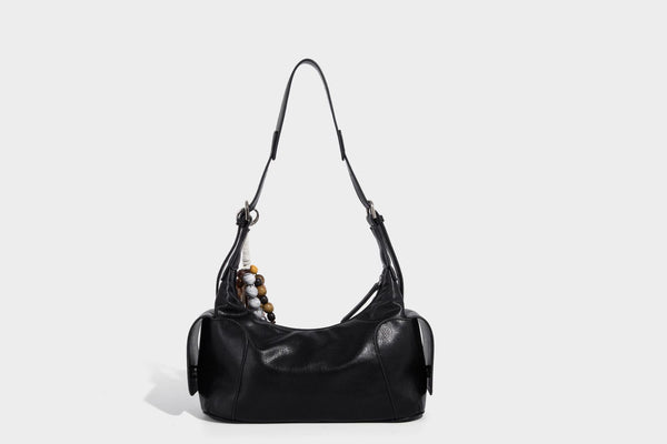 Soft pebbled leather-look hobo shoulder bag with zip top closure, side flap pockets, and silver-tone hardware, detail view 19