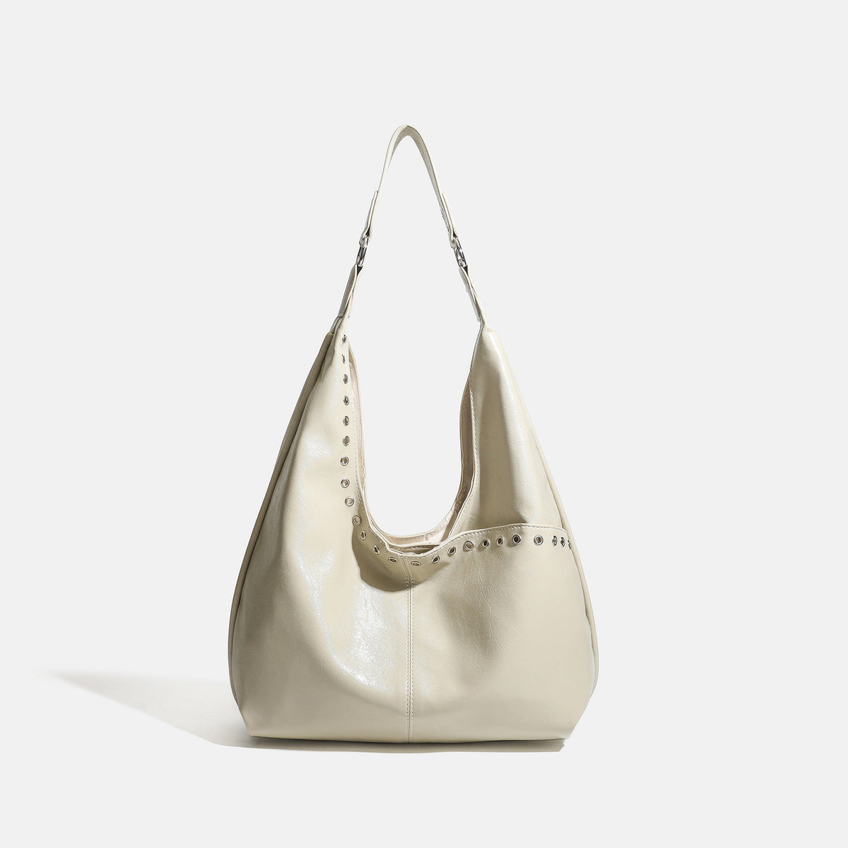 Large slouchy hobo shoulder bag with silver eyelet trim and glossy leather-look finish, detail view 8