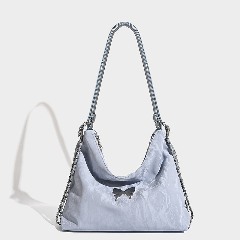 Crinkle-finish hobo shoulder bag with silver-tone chain side panels and butterfly embellishment, detail view 6