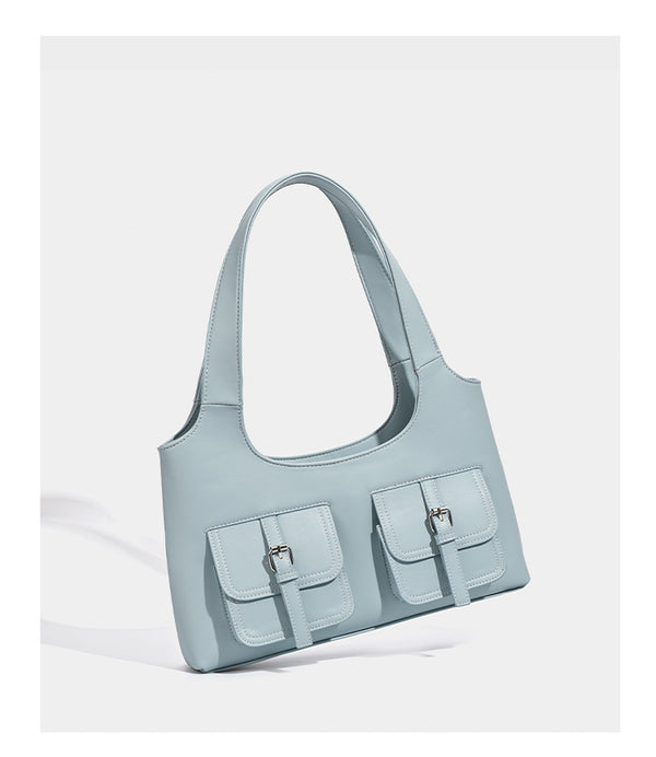 Powder blue structured tote bag with dual front flap buckle pockets and silver-tone hardware, detail view 10