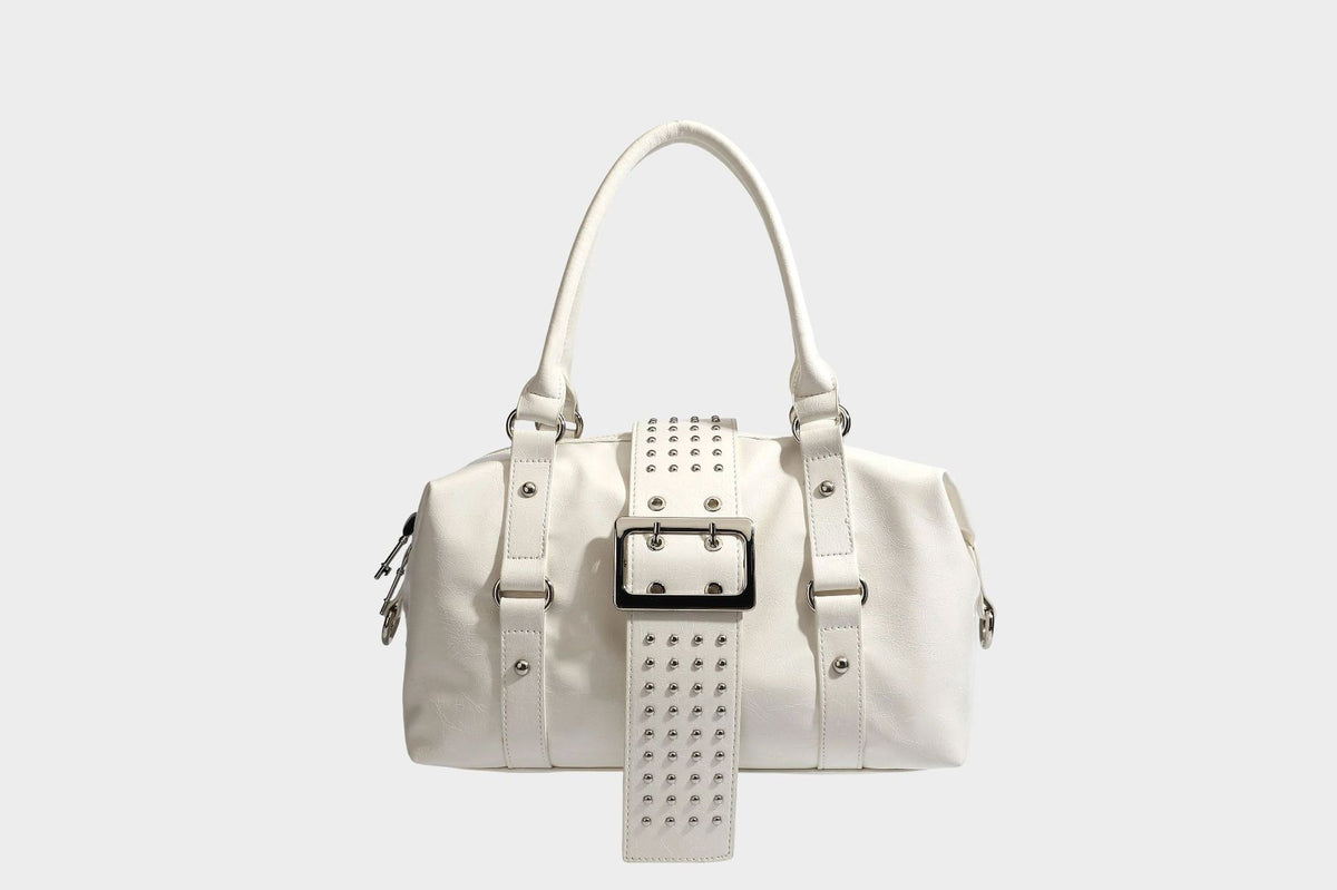 Glossy crinkled barrel handbag with silver stud buckle strap and detachable shoulder strap, detail view 23