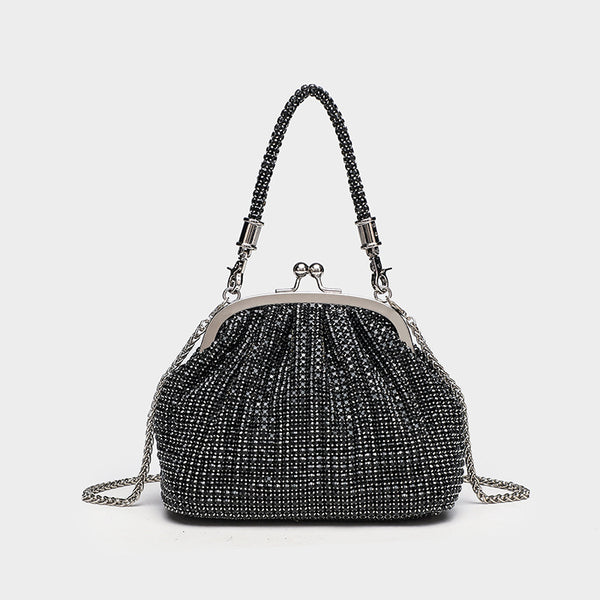 Kompakte Abendtasche mit rundum applizierten Strasssteinen, silberfarbenem Metallrahmen, Strass-Tragegriff und abnehmbarer Kette