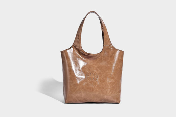 Glossy oil-wax leather-look open-top tote shoulder bag with embossed circular logo and long double straps, detail view 18