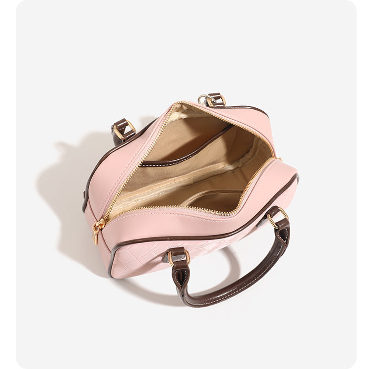 Small structured blush pink quilted diamond Boston barrel bag with brown leather-look trim, double top handles, heart accent