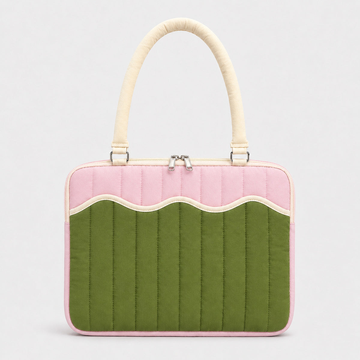 Quilted colorblock handbag with wavy scalloped front panel, padded arched top handles, and dual zip closure, detail view 6