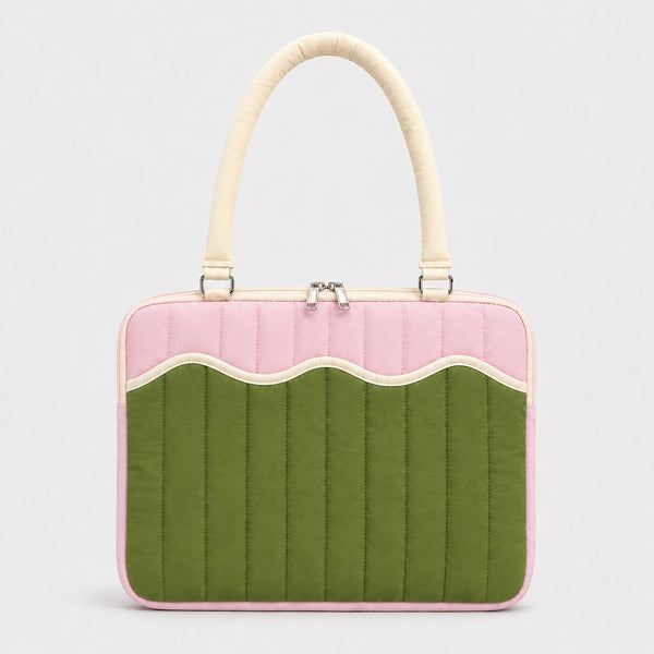 Quilted colorblock handbag with wavy scalloped front panel, padded arched top handles, and dual zip closure, detail view 6
