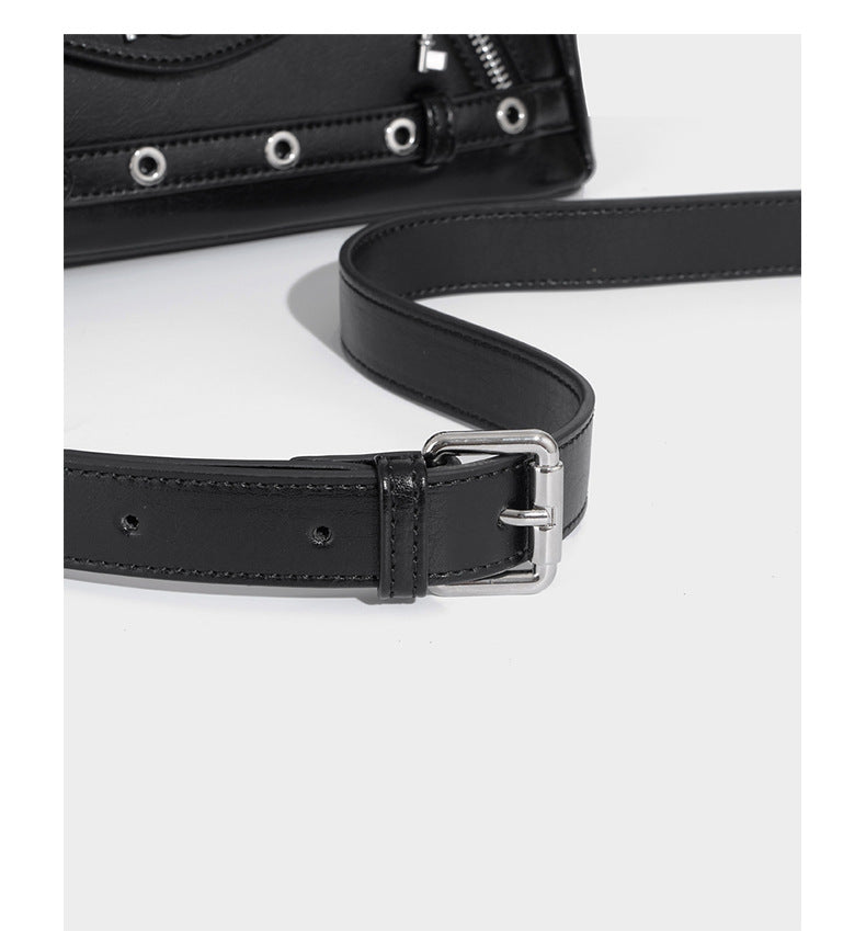 Structured black leather-look satchel bag with silver padlock hardware, front zip pockets, key charms, and top handles
