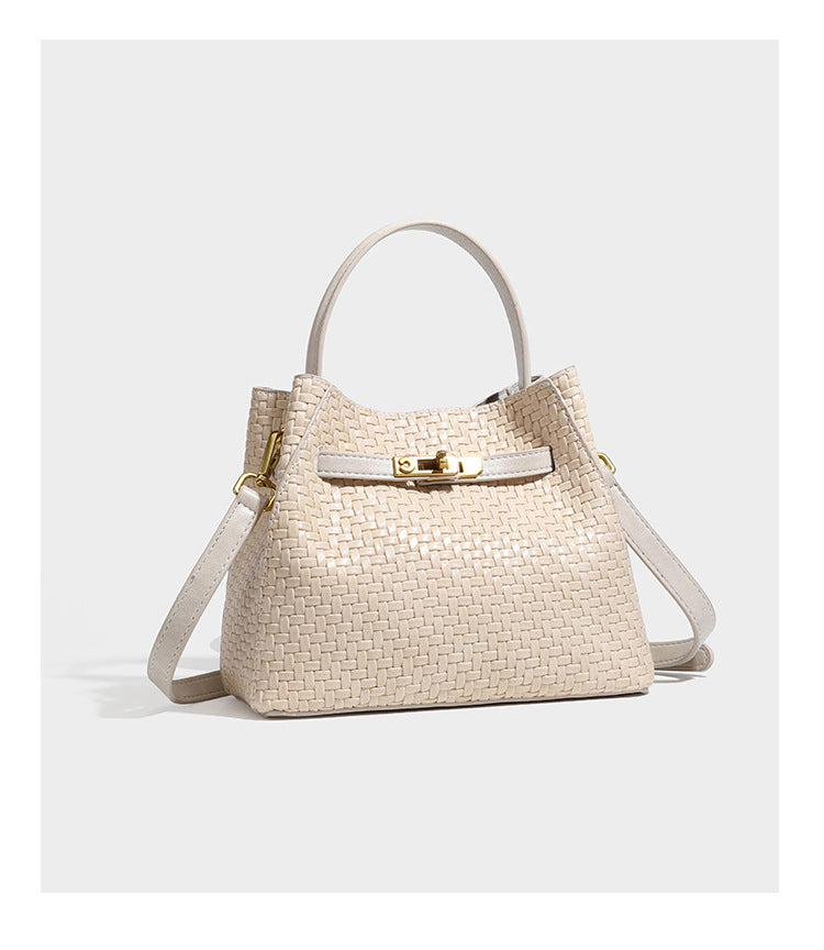 Structured woven leather-look bucket bag with gold-tone turn-lock hardware and detachable shoulder strap, detail view 23