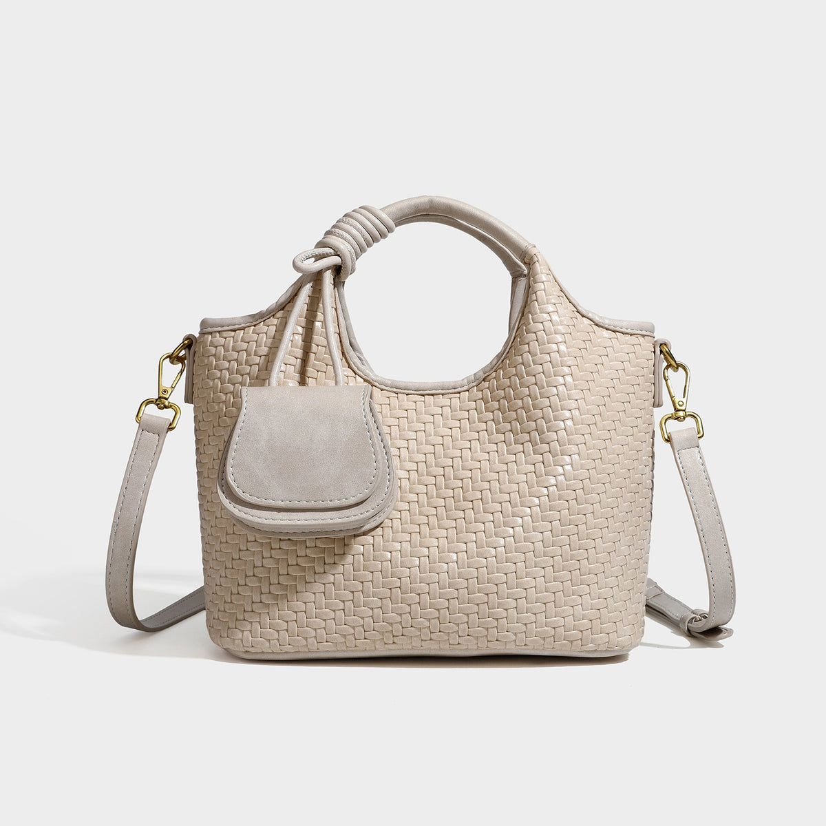 Woven leather-look tote bag in mocha brown with knotted top handle, front flap pocket, and detachable crossbody strap with